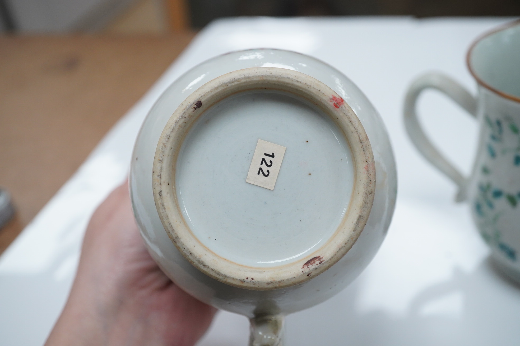 Three 18th century Chinese export armorial mugs, largest 14cm high. Condition - all restored